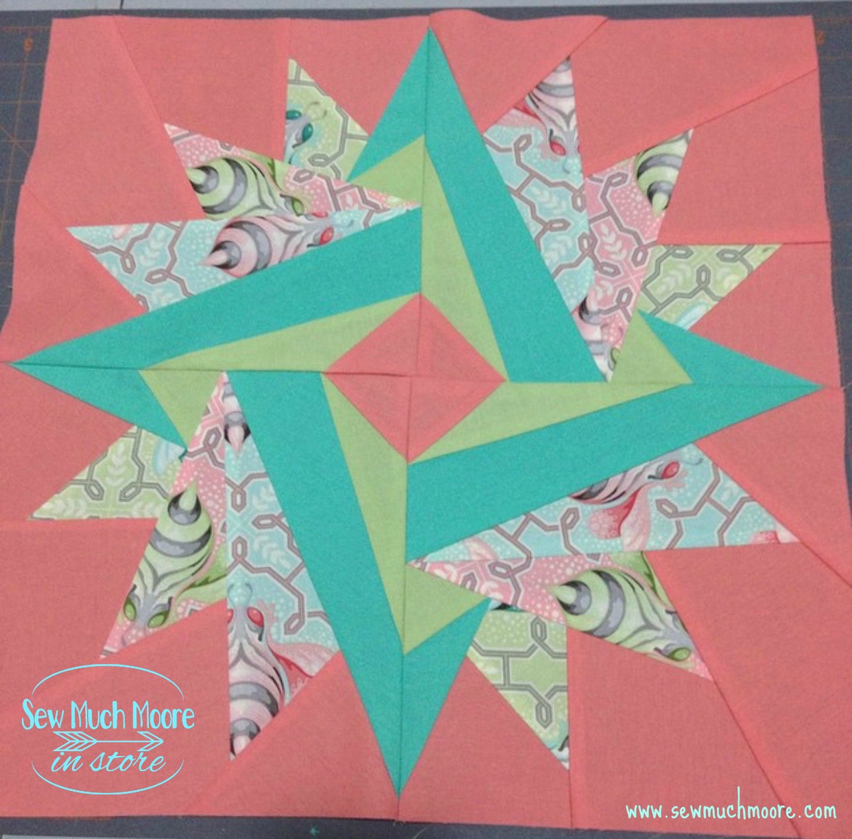 Make this lovely Springtime Mini Quilt! Get the pattern and materials list and get started! #Tutorial #Free #Pattern #Printables #Quilts #Pillows #Easy #Templates #Star #ForBeginners #Beginner #Art #Desgin #ArtDesign #Block #Hip #Trendy #SewMuchMoore #SewMuchMooreInStore