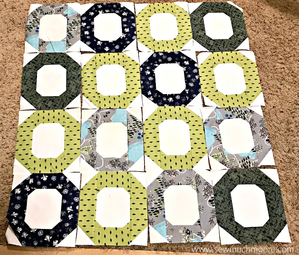 Deciding on a quilt layout is always fun. Learn how to make this cute baby quilt - It's fun and easy! #forbeginners #easy #jellyroll #ideas #modern #baby #ToMake #Designs #Simple #Blocks #Tutorial #HandQuilting #Big Stitches #Embroidery #quilting #sewing #handmade #GiftForBaby #FreeMotionQuilting #Project #Patchwork #Contemporary #WalkingFoot #DIY #Fabric #BabyBoy #BabyGirl #Nursery #Bedding #SewMuchMoore #SewMuchMooreInStore #Hip #Trendy