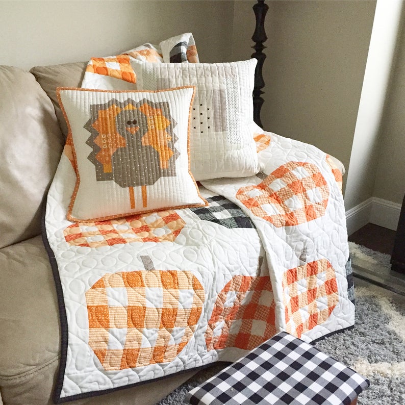 The Gobble Gobble Turkey Pillow Cover uses traditional piecing techniques (no foundation paper piecing) and finishes at 18" x 18".